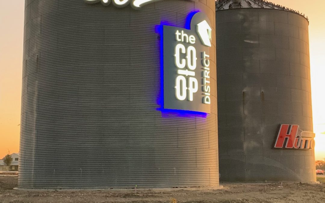 Creativity Delivers in Welcome Silo Sign For Hutto Co-Op